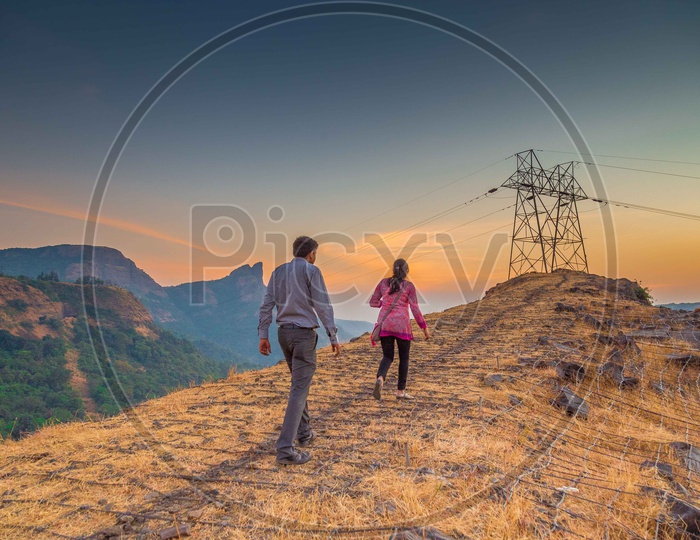 A Couple Walking On a Hill Top Of Western Ghat Range