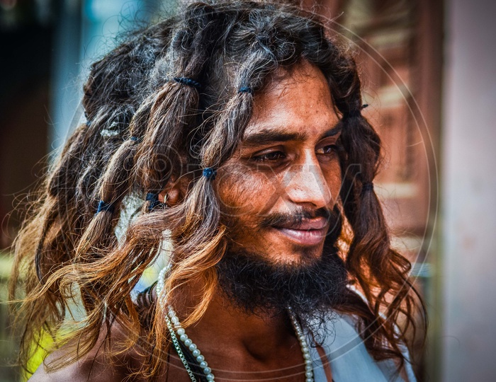 Portrait of Indian Sadhu Or Baba With Smiling face And Hair Braids