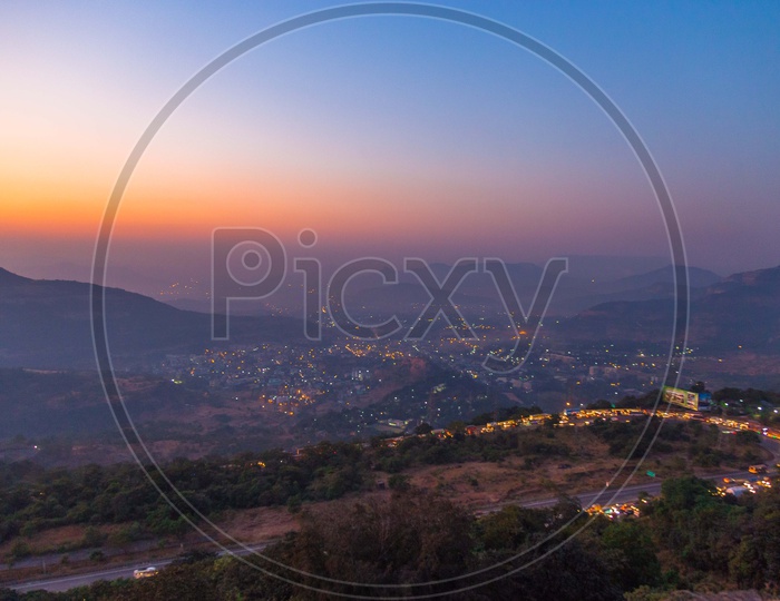 Aerial View Of Luminous Light Of A City From a Hill Top