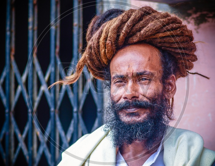 Portrait of Indian Sadhu Or Baba With Smiling face And Hair Braids