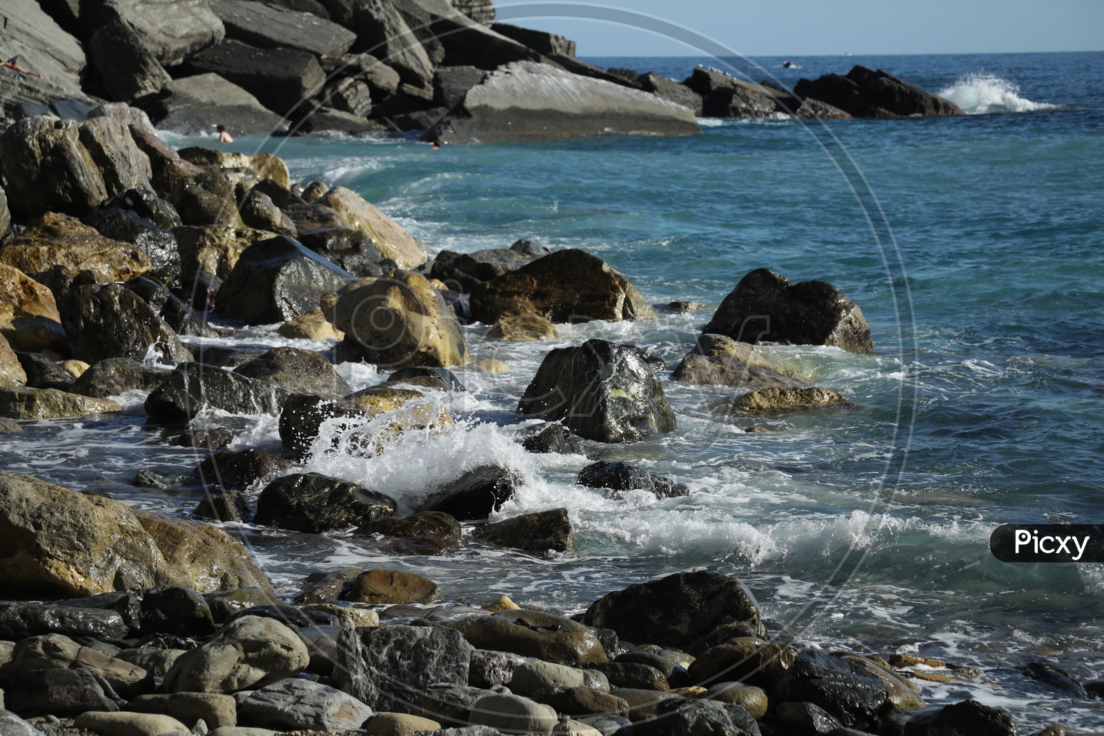 Sea / Ocean Waves Striking Rocks In a Beach