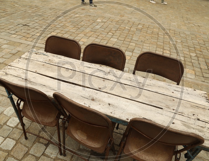 A wooden table with chairs