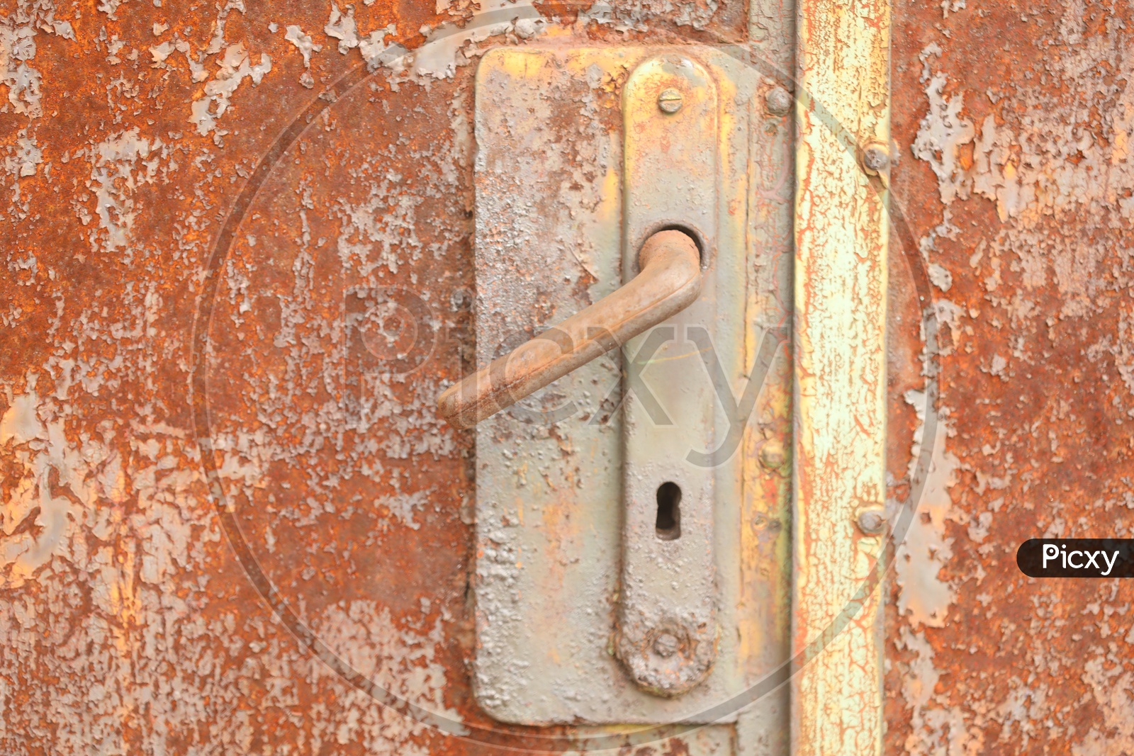 A rusted door with a handle