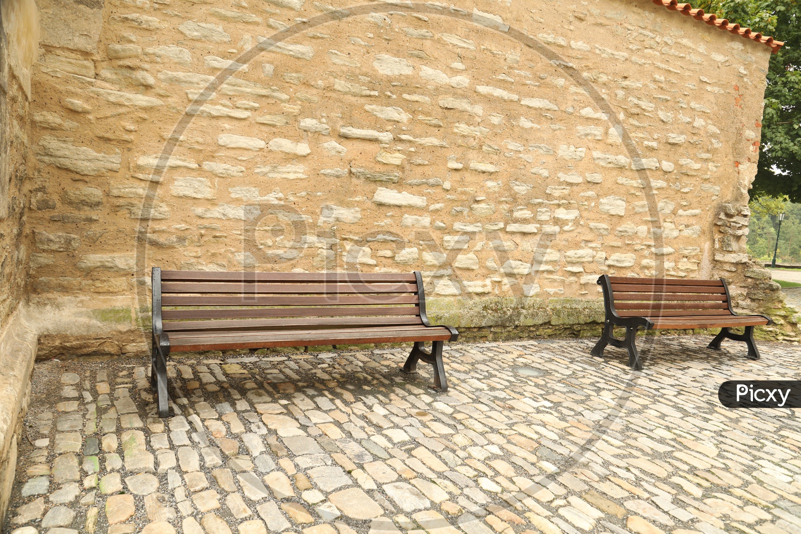 Benches alongside the old stoned wall