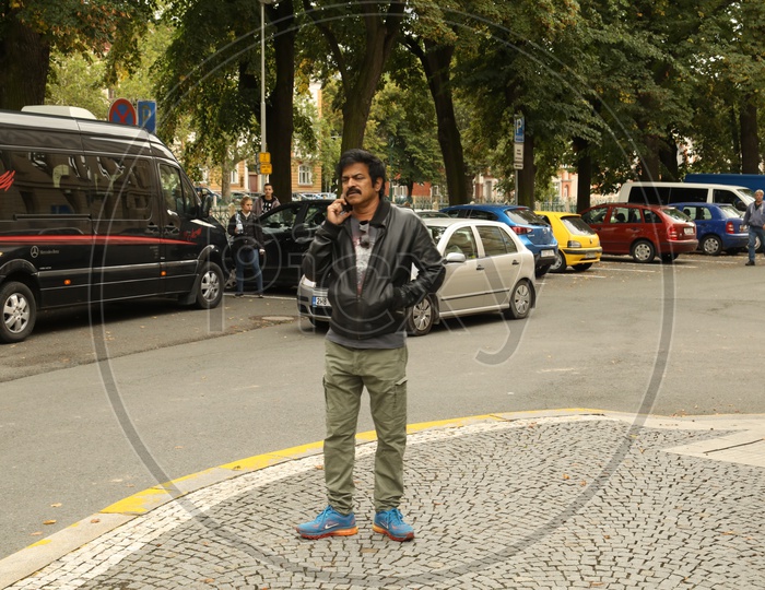 Indian Telugu Actor Bramaji Talking In Mobile On a Road