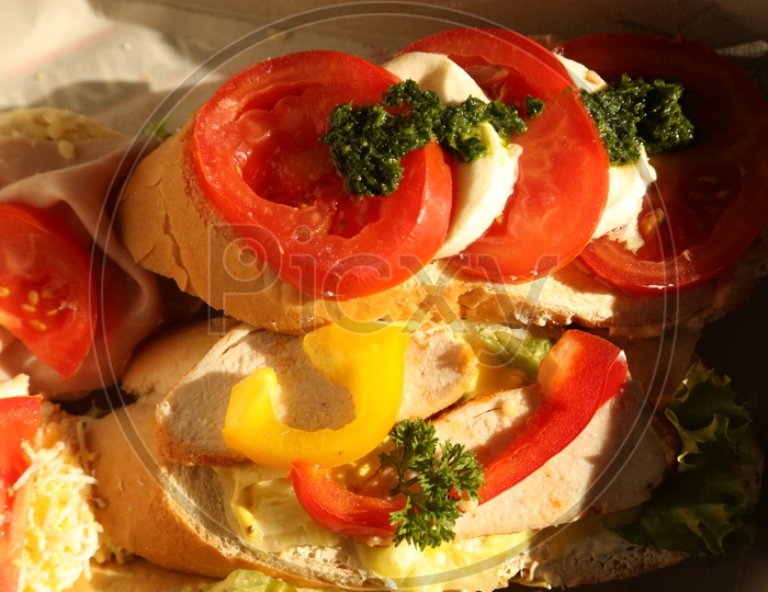 Vegetable Toppings Over Garlic Bread for Breakfast