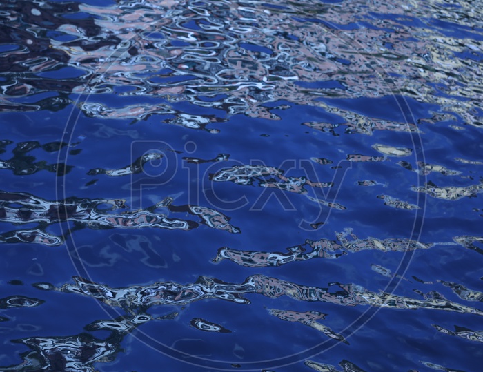 Texture of Ripples Over  Sea Water With Luminous Blue Colour
