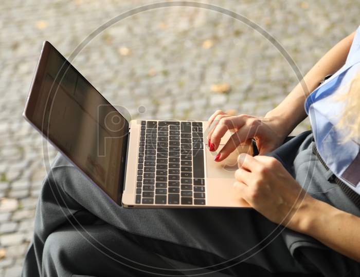 A woman   Working on Laptop