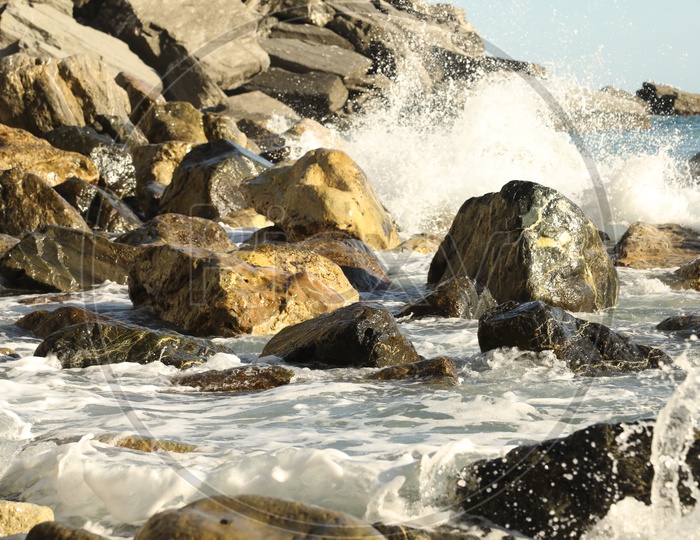 Sea / Ocean Waves Striking Rocks In a Beach