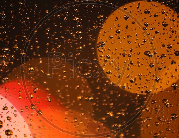 Water Droplets on a Glass With Led Light  Bokeh in Background