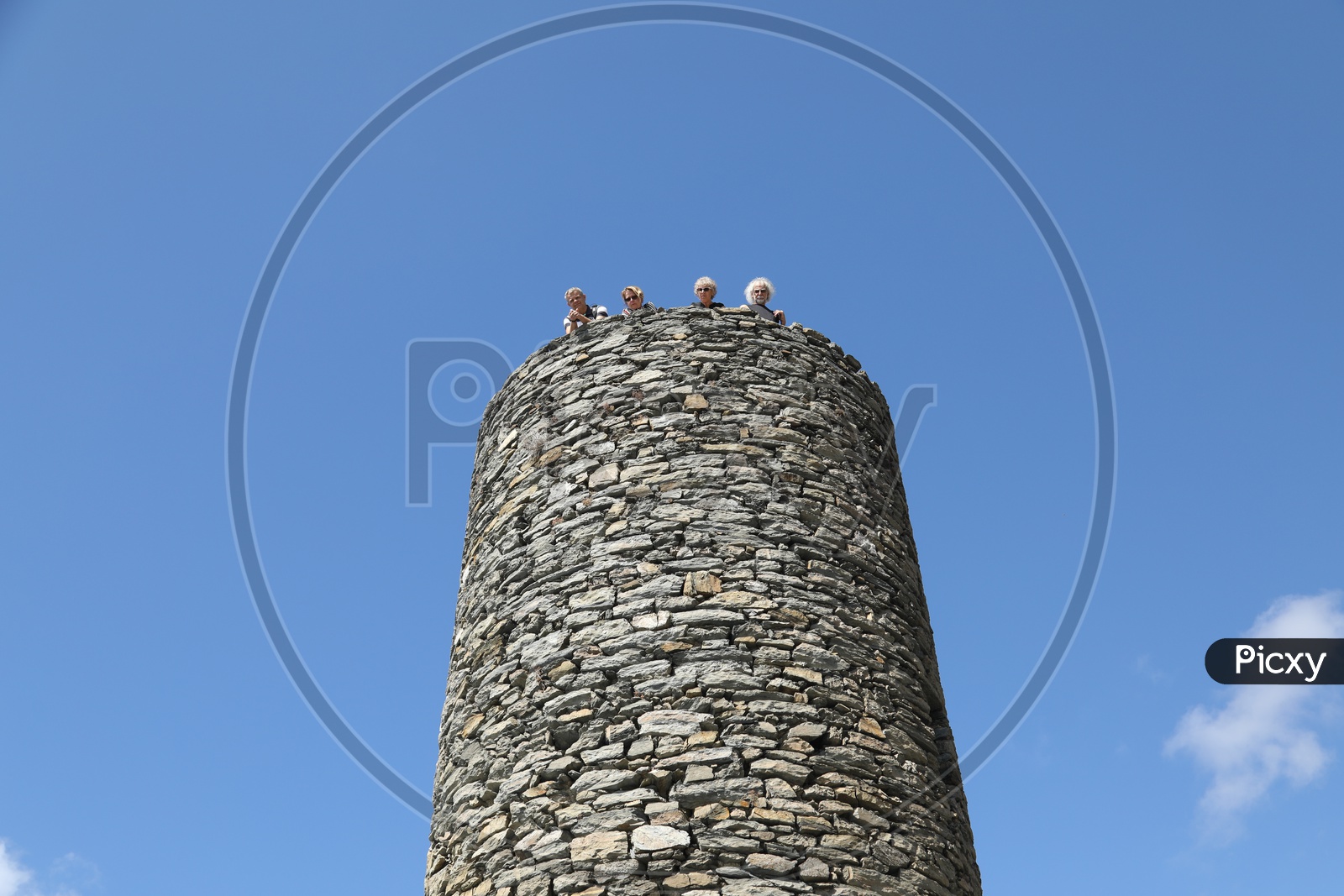 Visitors on top of a Stone Tower