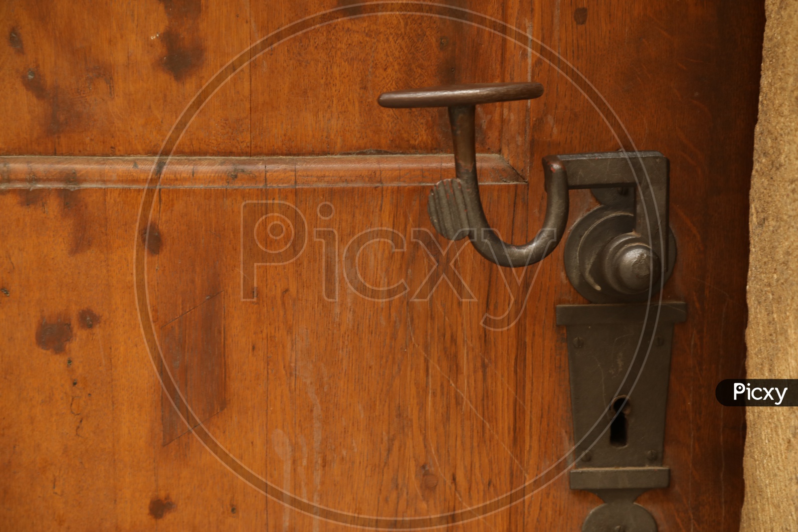Metal handle on the wooden door