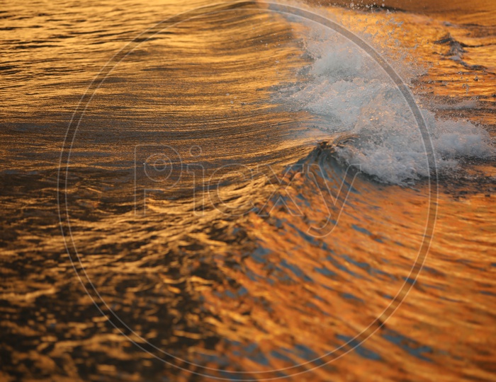 Waves Of a Sea / Ocean With Gold Luminous Colour of Sun