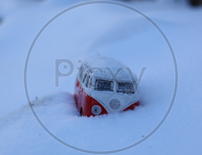 A toy bus in the snow