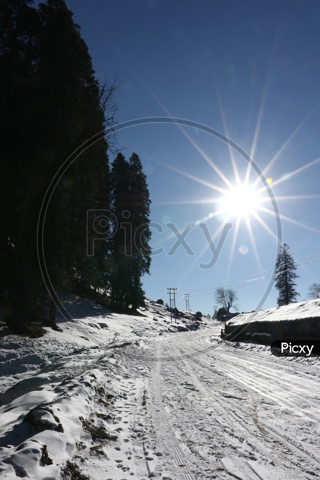 Roads with full of snow and a bright sun