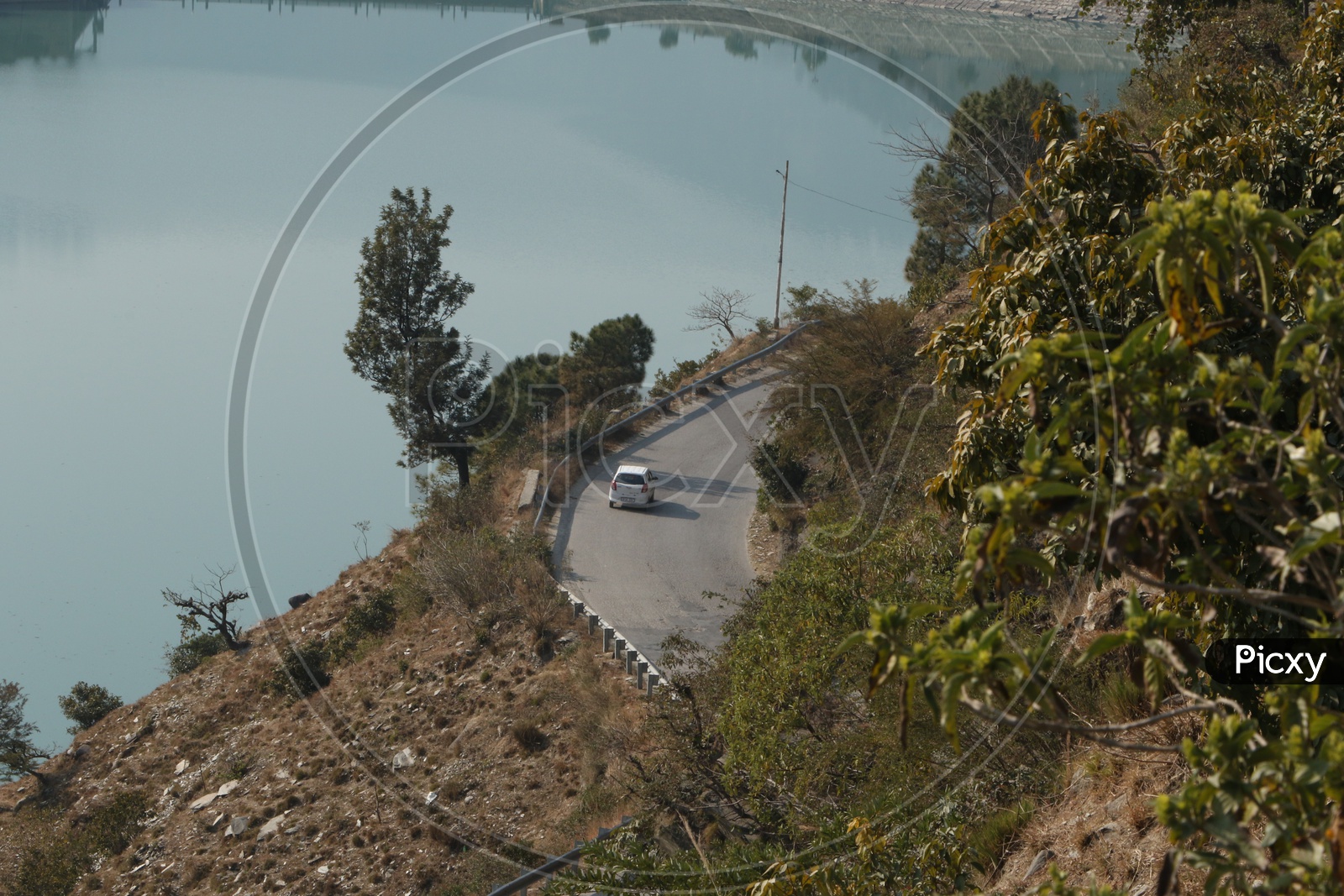 Top view of a moving car in the ghat road in hills