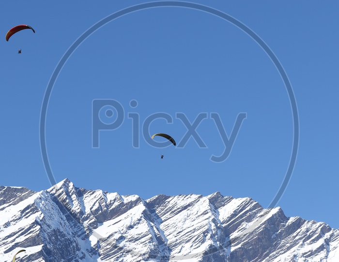 Paragliding in the mountains  full of snow