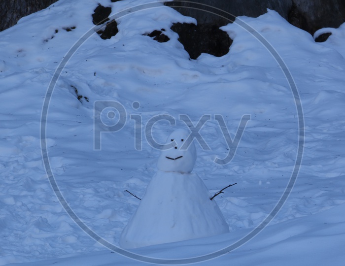 A snow man in the mountains