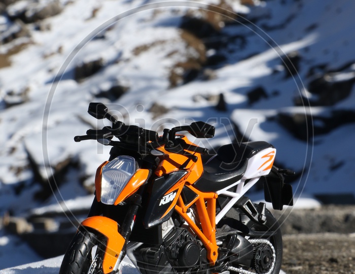 KTM sports bike toy in the snow