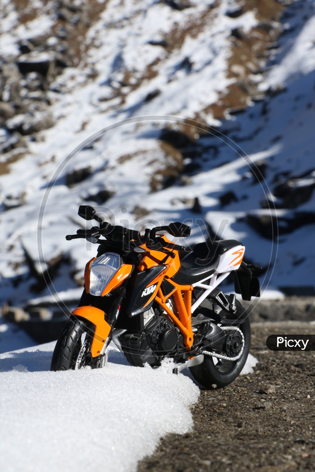KTM sports bike toy in the snow