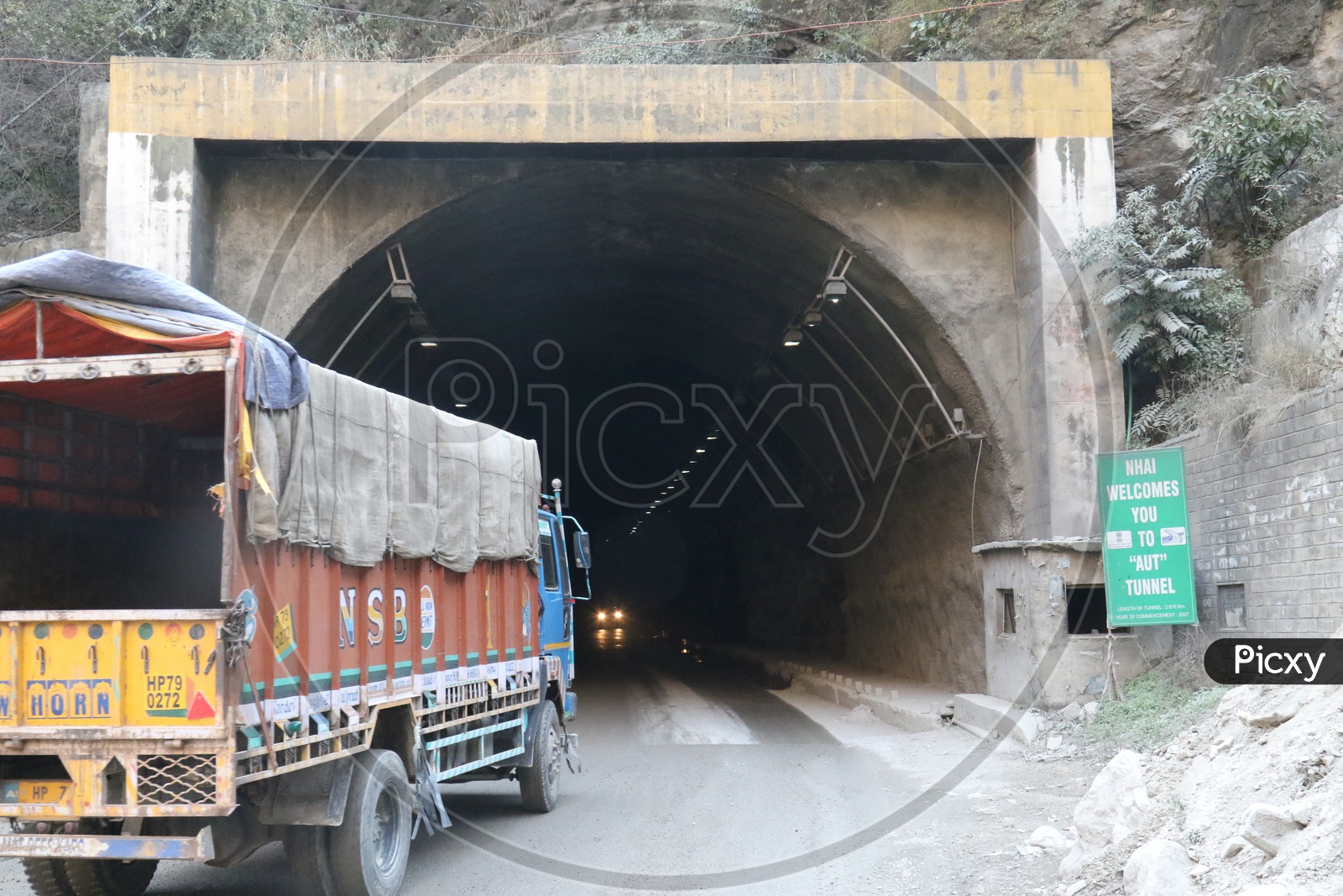 A truck going into the tunnel