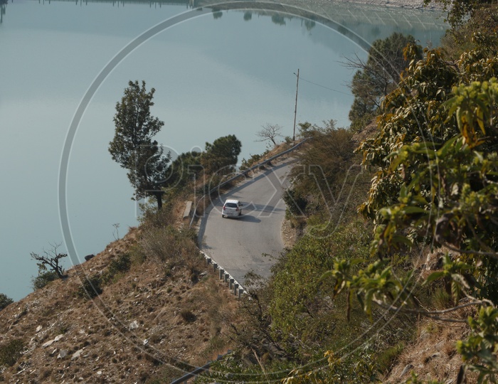 Top view of a moving car in the ghat road in hills