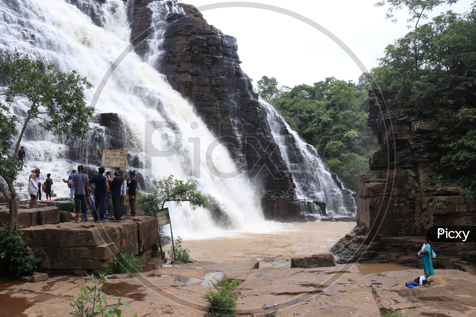 Tourists enjoying water fall