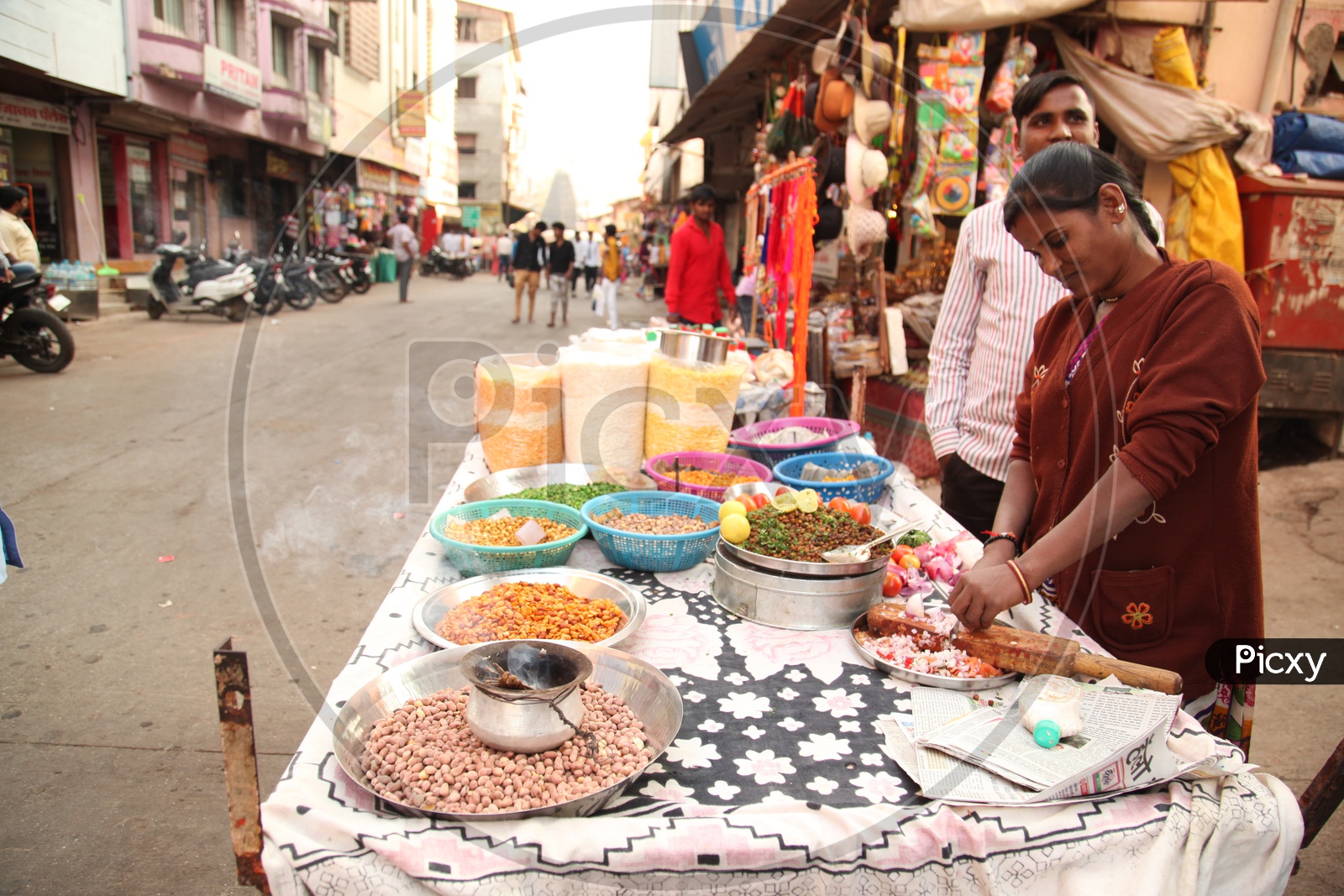 A woman selling chat in a street