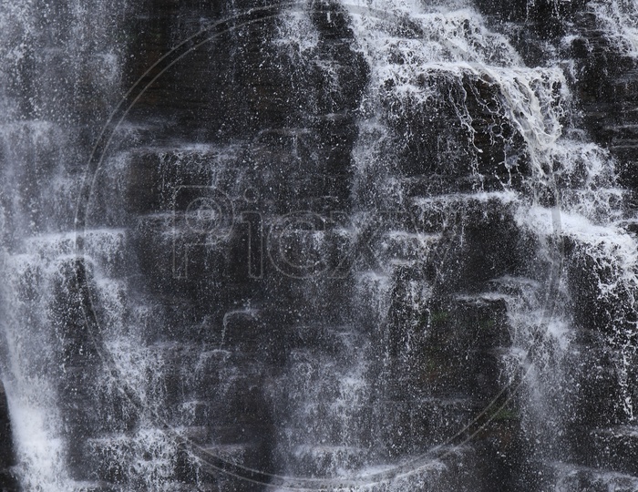 Water falling From the Rocks With patterns and Texture of Rock