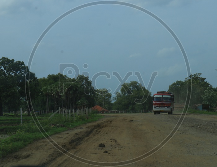 Travel bus on a mud road