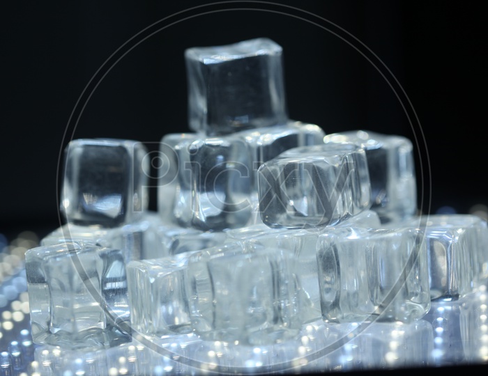 Ice Cubes / Glass Crystal Cubes On a Led Lights Background  Representation