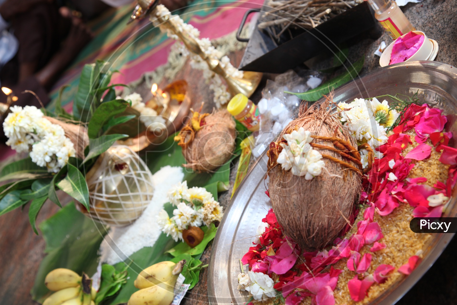 Image of Kalasam, coconut, flowers for worship in a wedding ...
