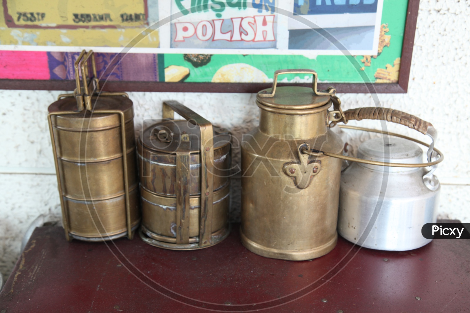 Indian lunch boxes and milk cans made of brass