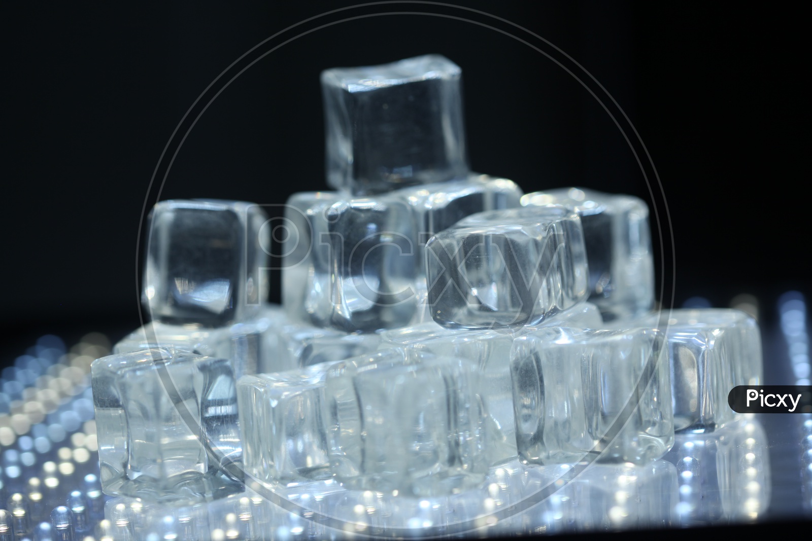 Ice Cubes / Glass Crystal Cubes On a Led Lights Background  Representation