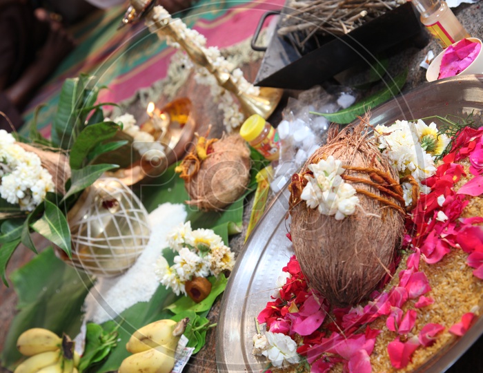 Kalasam, coconut, flowers for worship in a wedding ceremony