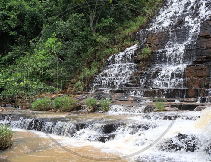 Water Falling On Rocks in a Water Falls