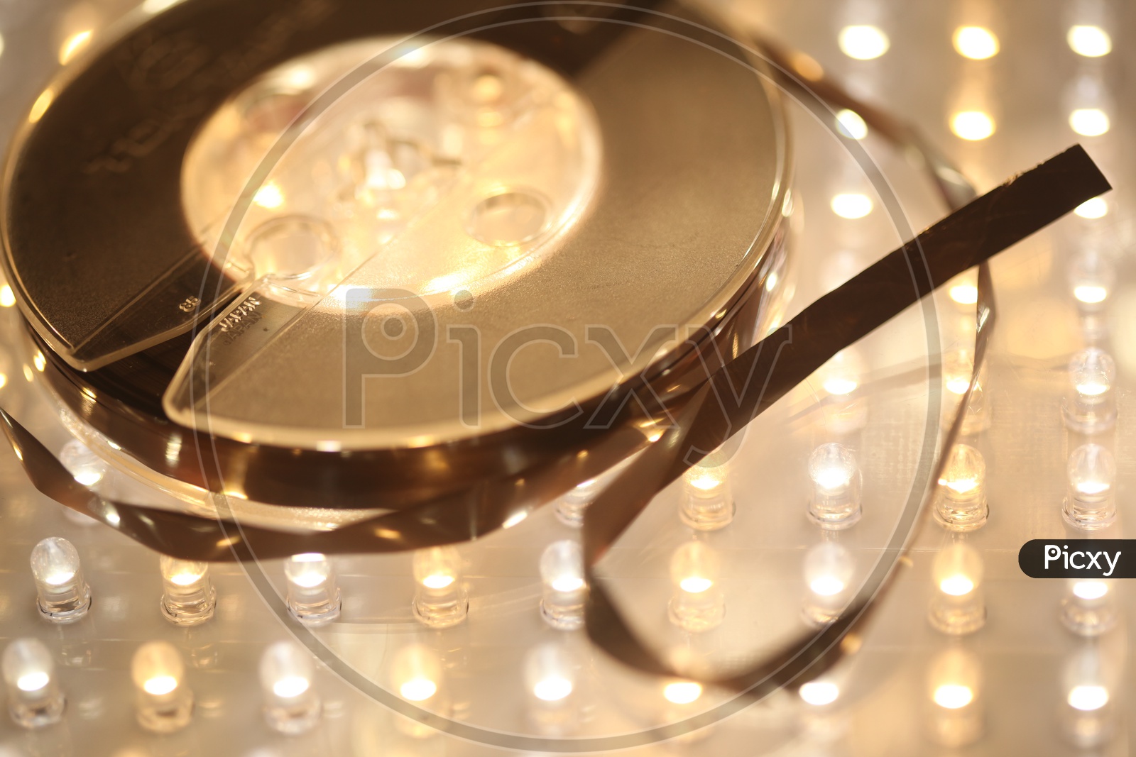 An Audio cassette Tape Reel  Closeup Shot With Led Bokeh Background
