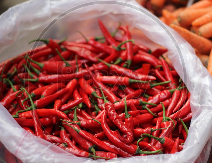 Close up shot of red chillies placed in a bag