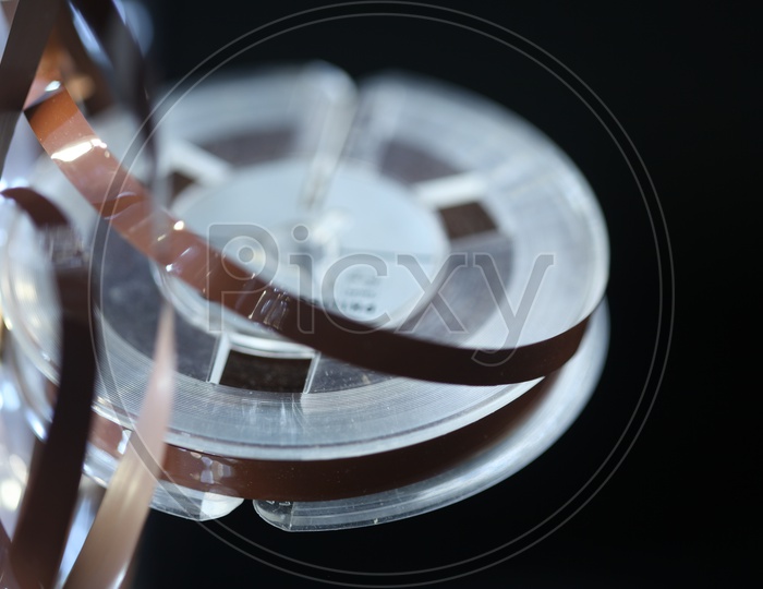 An Audio cassette Tape Reel  Closeup Shot With Led Bokeh Background