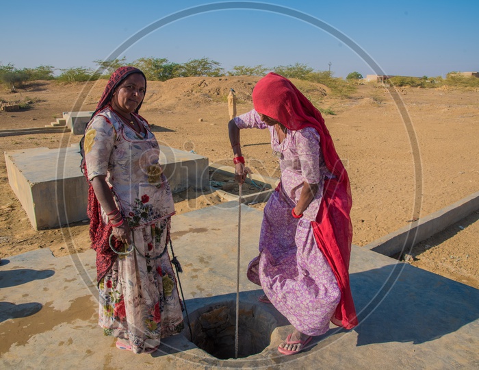 Women digging water