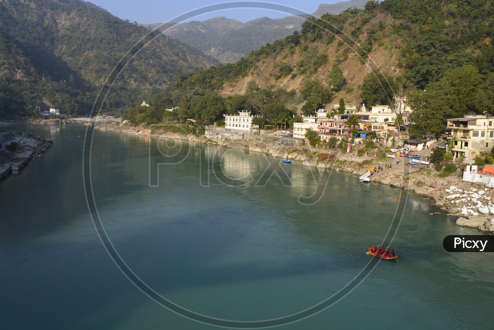 people go on a boat on ganga river in haridwar