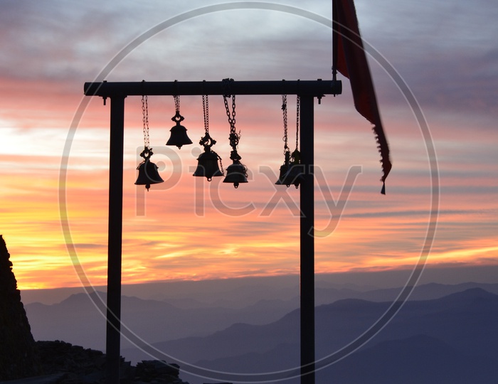 Hanging Bells on a Sunset Sky