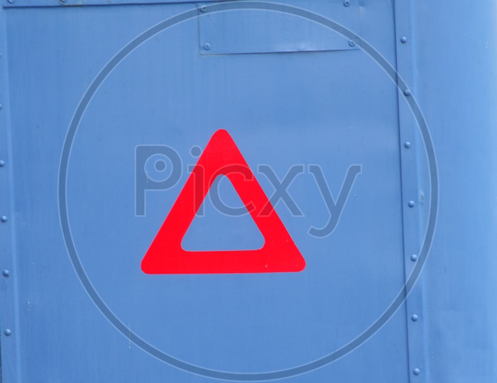 A red coloured triangle sign
