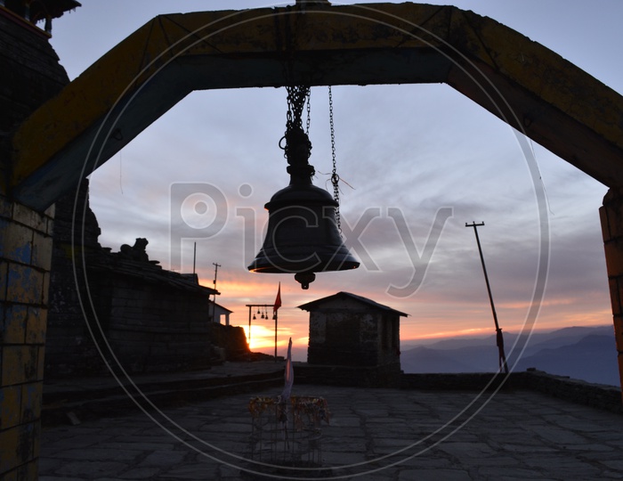 Hanging bell during a sunset
