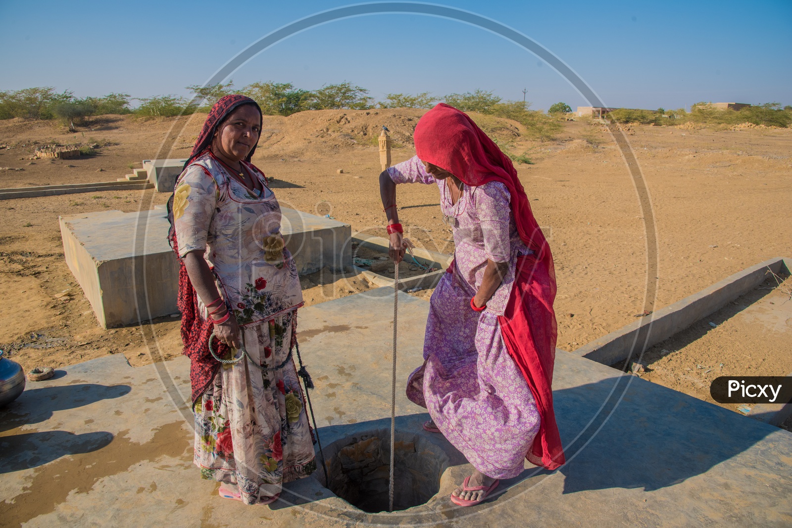 Women digging water