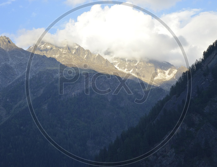 Landscape of beautiful Mountains of Gangotri with huge clouds