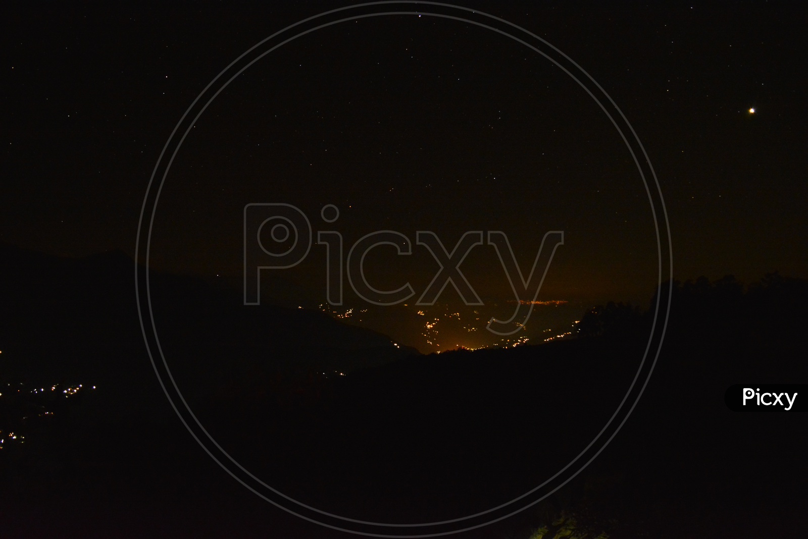 Beautiful stars with city lights in Chopta