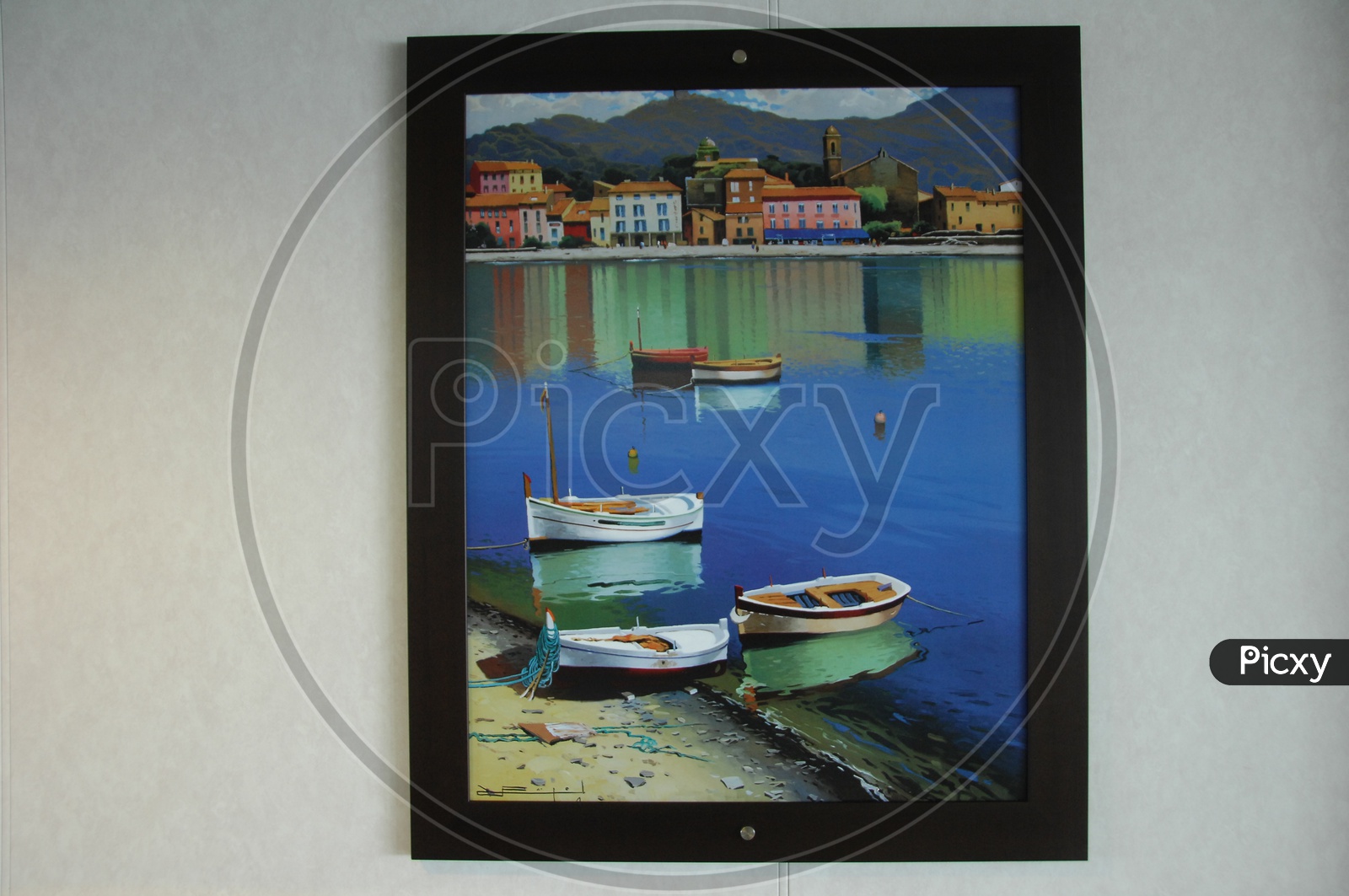 A photo frame of a painting of boats