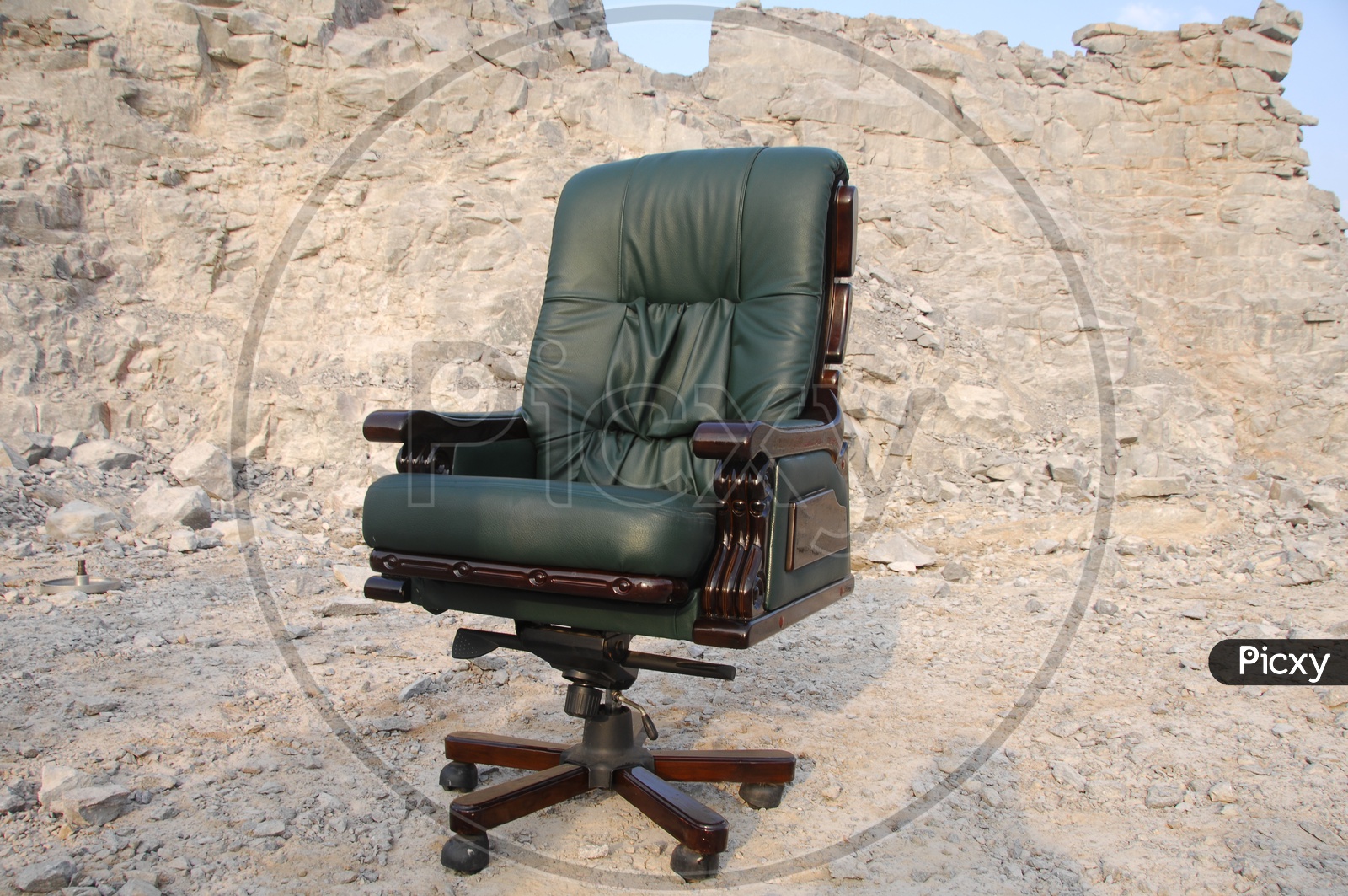 An Office Chair With Cushion over a Rock hill Background