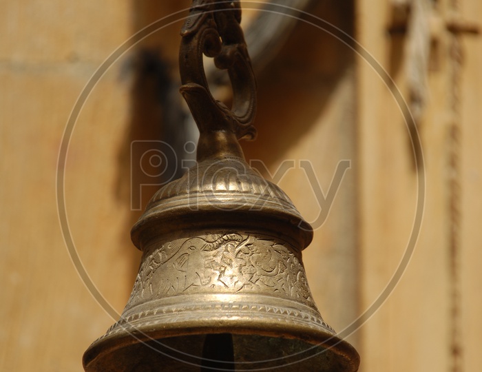 A traditional bell carved with design